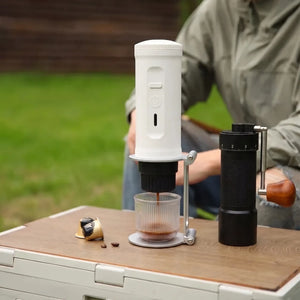 YomiNobo portable espresso stand used outdoors on camping table
