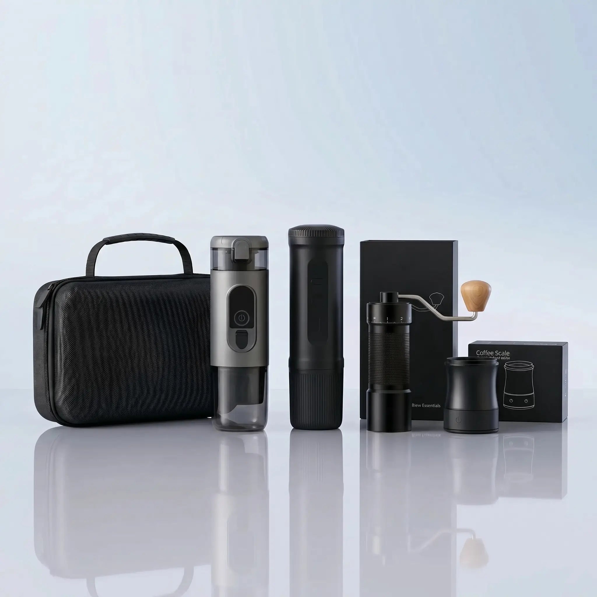 The complete best espresso machine travel kit: A sleek black portable espresso maker and silver insulated bottle set, accompanied by a high-end hand grinder with a wooden handle, a precise coffee scale, and a premium hardshell travel case against a soft blue gradient background.
