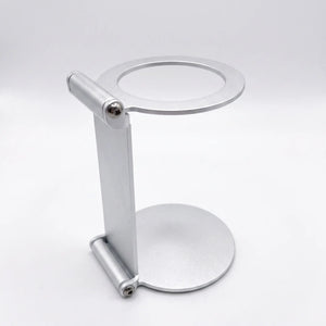 YomiNobo foldable espresso machine stand front view, silver aluminum